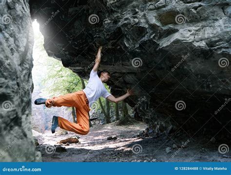 Man Rock Climber Climbing On The Overhanging Cliff Stock Photo Image