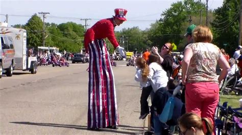 Clown On Skateboard And Woman On High Stilts Among Attractions At