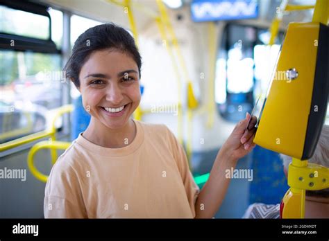 Indian Woman Paying Conctactless With Card For Public Transport Bus Or