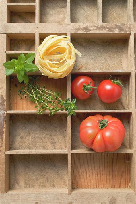 Ribbon Pasta Tomatoes And Fresh Herbs In Type Case Photograph By