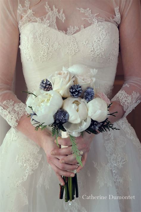 Beautiful Winter Wedding Bouquet With Roses Pine Cones And Peonies