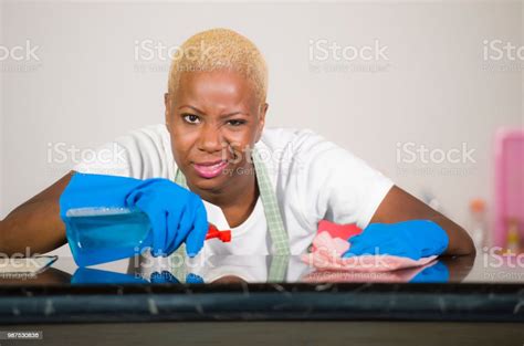 Young Attractive Stressed And Upset Back Afro American Woman In Washing Rubber Gloves Cleaning