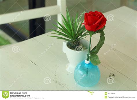 Vase Of Red Flowers On A Table Stock Image Image Of Bright Design