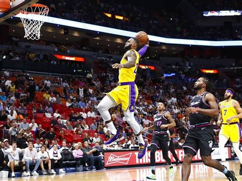 Find the perfect lebron james miami heat stock photos and editorial news pictures from getty images. WATCH: LeBron James poster comes to life in sneaker store ...