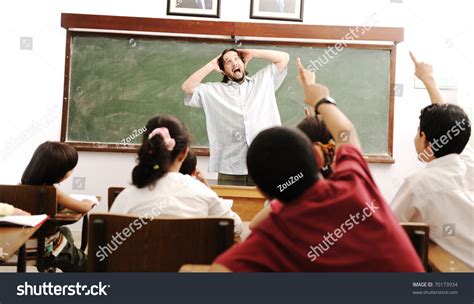 Kids In The School Classroom With A Mad Crazy Silly Teacher Yelling In