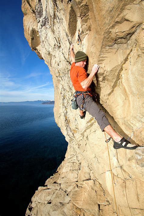 Rock Climber Finding A Foothold Photograph By Corey Rich Pixels