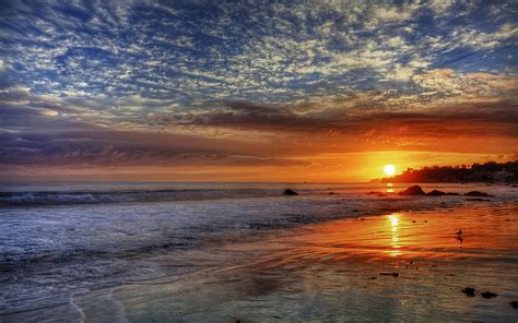 Sunset Red Sky Clouds Sea Waves Sandy Beach In Malibu California United