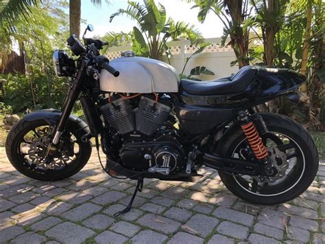 Almost every part of the bike was pure black: Harley-Davidson XR1200 Sportster Cafe Racer | Custom Cafe ...