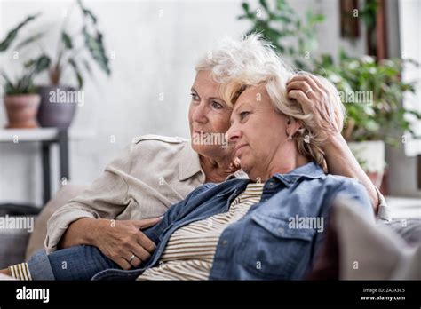 Mature Lesbian Couple At Home On Sofa Stock Photo Alamy