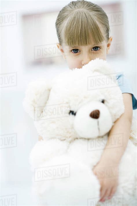 Little Girl Holding Large Teddy Bear Portrait Stock Photo Dissolve