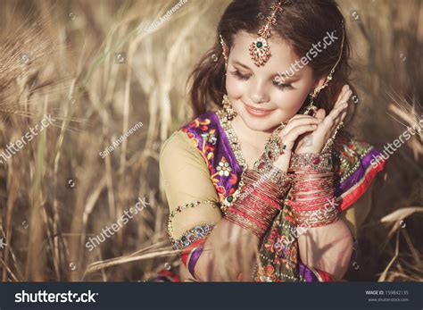 Happy Little Indian Girl Outdoors Traditional Stock Photo