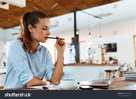 Beautiful Young Freelancer Woman Using Laptop Stock Photo