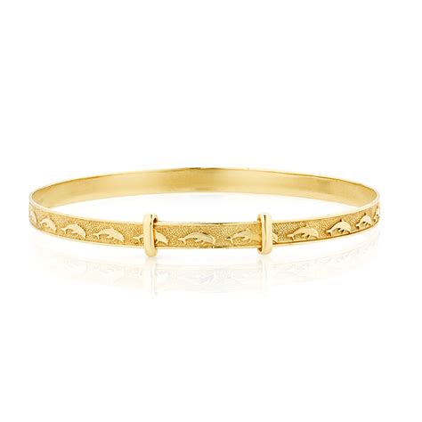 Baby bangle bracelets are shiny, smooth, and simple with open ends and adjustable options. Expandable Baby Bangle in 10ct Yellow Gold