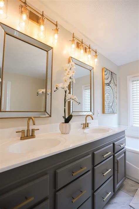 Placed behind the bathroom vanities and mirrors, it gives the room a modern feel. Master Bathroom By Everything Real Estate Champagne bronze ...