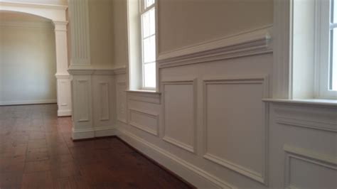 Chair rail molding unifies various architectural details in the room, such as door and window trim, fireplace mantels, etc. MITRE CONTRACTING, INC.: Crown Moulding