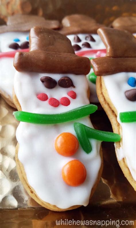 These cookies are perfect for your fall preschool themes and parties. Nutter Butter Snowmen Cookies | While He Was Napping