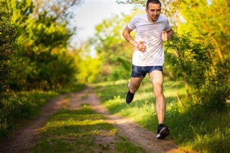 Athletic Young Man Running In Nature Stock Photo Image Of Lifestyle
