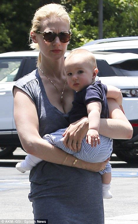 January Jones Goes For A Stroll With Son Xander In Clingy Low Cut Dress