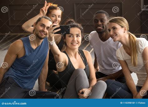 Multi Ethnic Sporty People Having Fun Taking Group Selfie In Gym Stock Image Image Of