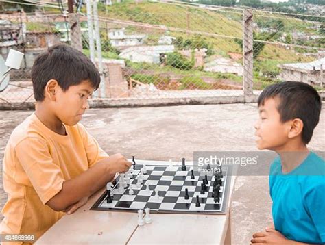 Boy Playing Chess Smile Photos And Premium High Res Pictures Getty Images