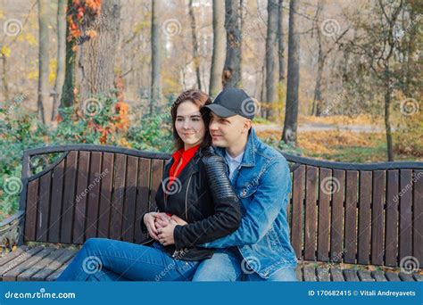 Happy Lovers In The Park On A Bench In Autumn Stock Image Image Of