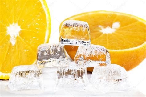Six Ice Cubes Melted In Water And Slices Of Orange Stock Photo By