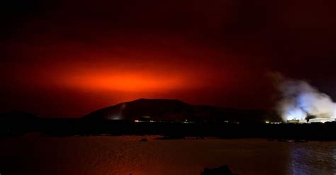 Icelandic Volcano Erupts Lights Up Night Sky Near Reykjavik