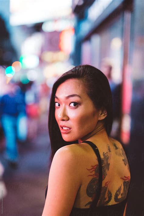 Asian Woman With A Tattoo On The Back By Stocksy Contributor Vero Stocksy