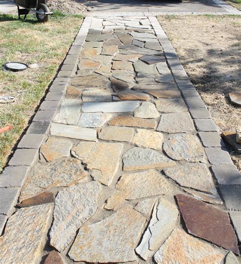 Align delivered stone near the side where you will finish the patio so you don't have to retrieve materials over just laid stones. {Better Remade} flagstone walkway | Diy stone patio, Stone patio designs, Backyard walkway