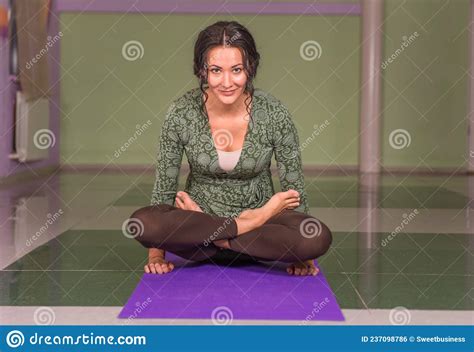 Yoga Master Demonstrating Yoga Positions In The Gym Stock Photo Image