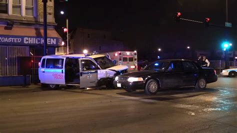 2 Officers Injured After Car Slams Into Police Van Officials Say