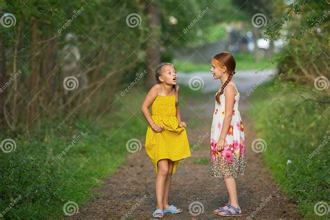 Two Little Cute Girlfriends Animatedly Talking Stock Image Image Of Happiness Camp 75434881