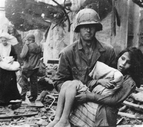 February 1945 In Manila An American Gi Rescues An Injured Filipino