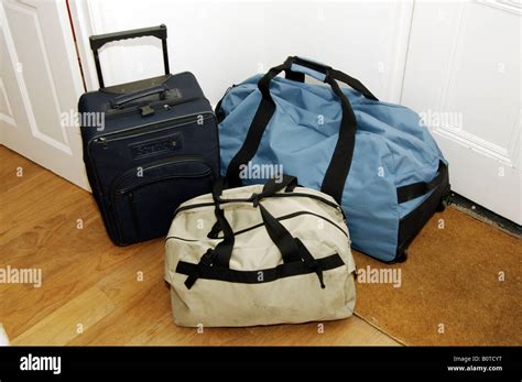 Travel Bags Packed And Ready To Go On Floor In Home Stock Photo Alamy