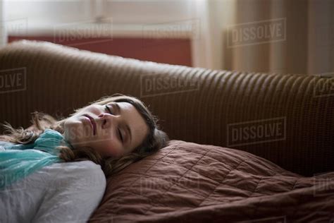 Girl Lying On Bed Asleep Stock Photo Dissolve