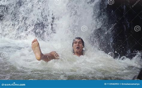 Happy Handsome Man Relaxing Under Stream Water In Waterfall In Tropical Jungle Slow Motion