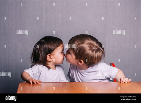 Little Boy Kisses Little Girl Stock Photo Alamy