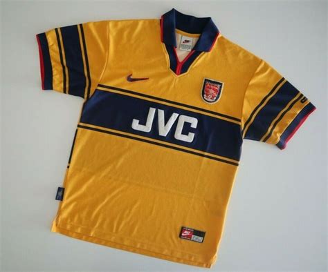 A Yellow And Blue Soccer Jersey With The Jvc Logo On Its Chest