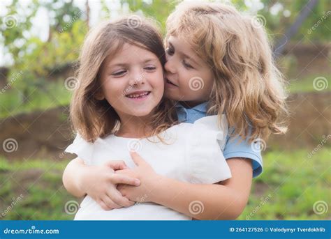 Little Boy And Girl Best Friends Hugging Kids Kissing Each Other With