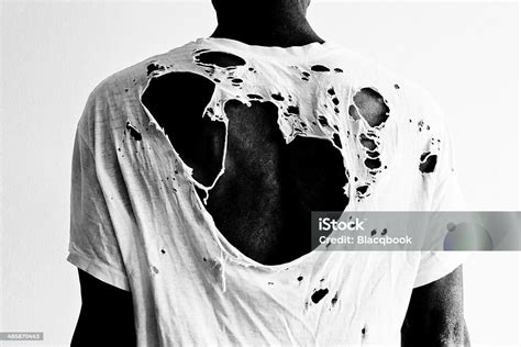 Back Of A Man With A Ripped White Tshirt Stock Photo Download Image
