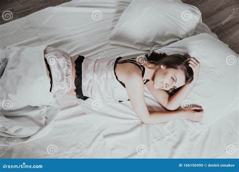 Girl In Pink Pajamas Lying On Bed Stock Photo Image Of Brick
