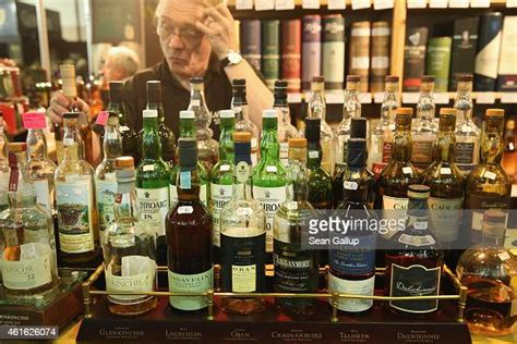 Bottles Of Scottish Single Malt Whisky Stand On Display At A Stand At