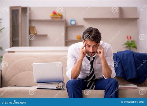 Young Male Employee Working From Home During Pandemic Stock Image