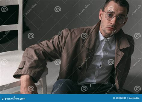 A Lonely Handsome Guy In A Raincoat And Glasses With Different Moods