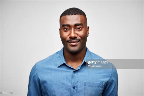 Confident Black Man Against White Background High Res Stock Photo