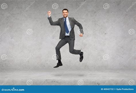 Smiling Businessman Jumping Stock Photo Image Of Creative Jumping