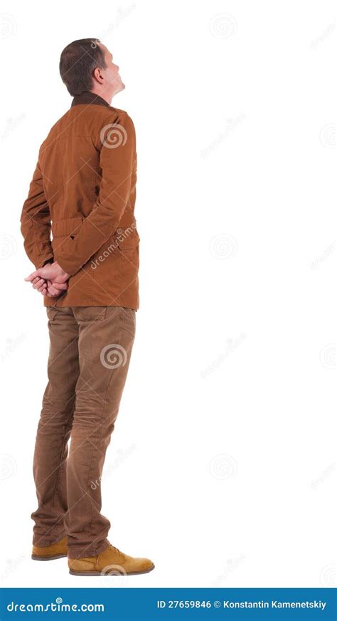 Back View Stylishly Dressed Man In A Brown Jacket Looking Up Stock