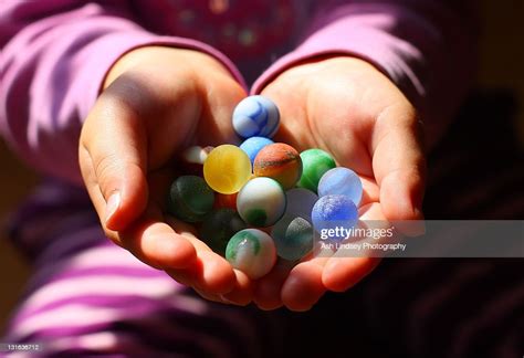 Human Hand Holding Marbles Foto De Stock Getty Images