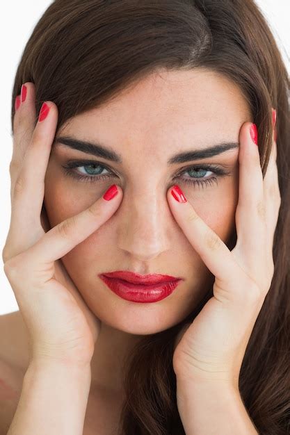 premium photo woman touching her face while wearing red lipstick