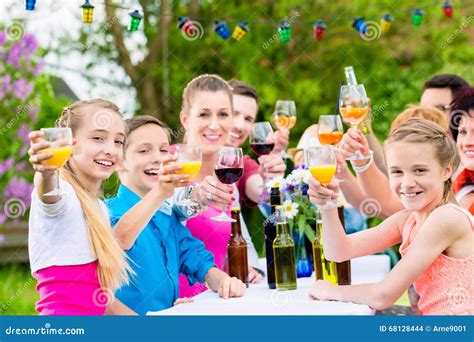 Friends And Neighbors Toasting On Garden Party Stock Photo Image Of
